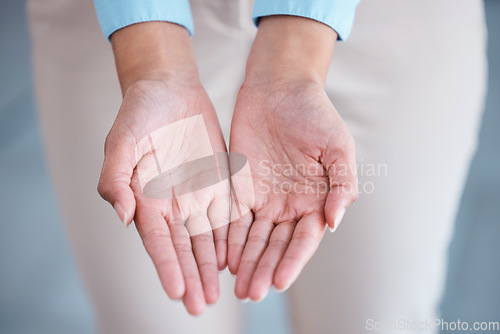 Image of Above view and closeup of two hands extended with open palms in a giving and receiving gesture. Unknown mixed race businesswoman asking for help. Hispanic office professional offering support