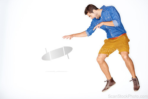 Image of Jump, fight and a man on a white background for attack, aggressive or angry with mockup space. Anger, studio and a frustrated, crazy or screaming guy or person with mental health on a backdrop