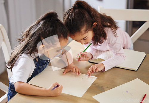 Image of Two girls playing together. two girls completing their homework together.