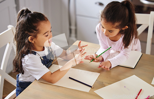 Image of Sisters are built in best friends. two girls completing their homework together.