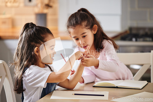 Image of Use your fingers its easy. two girls completing their homework together.