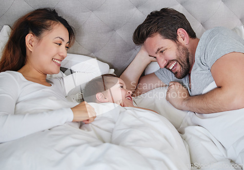 Image of Nap time for all of us. a young family relaxing at home.