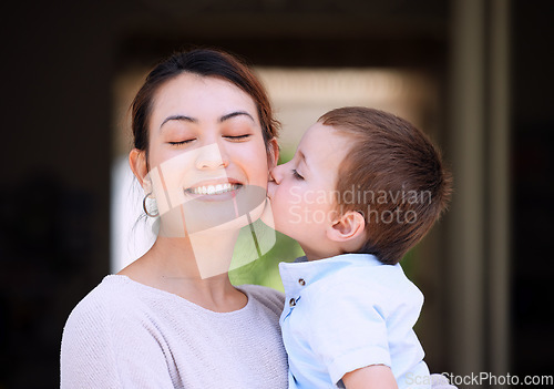 Image of Enjoying some family fun. a mother carrying her son on the porch at home.