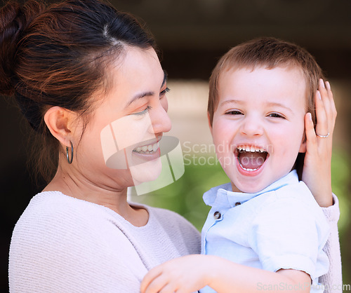 Image of Family comes first. a mother carrying her son on the porch at home.