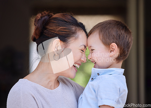 Image of Making the most of a beautiful day. a mother carrying her son on the porch at home.