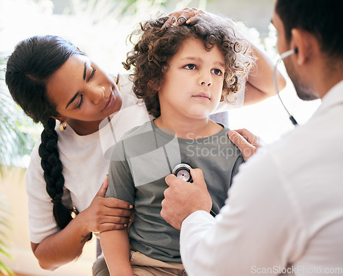 Image of Please make him better. a little boy being examined by an unrecognizable doctor while his mother holds him.