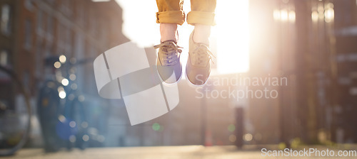 Image of Feeling light as a feather. a man jumping in joy mid air.