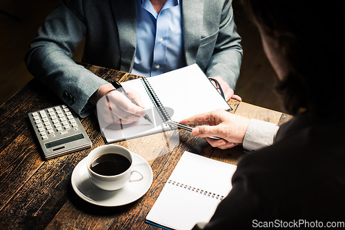 Image of The place of inspiration. a businessman brainstorming ideas with a coworker.