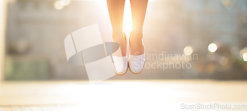 Image of Get those feet in the air. a woman jumping mid air in happiness.