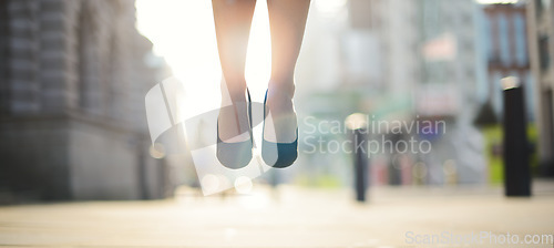 Image of Business has never been better. a businesswoman jumping in the air.