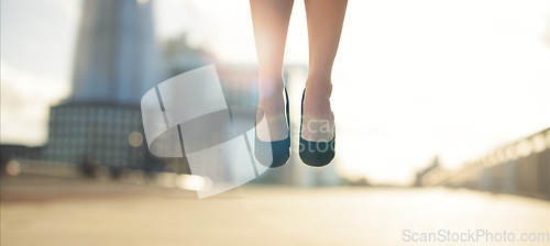 Image of Expressing happiness in every way possible. a businesswoman jumping in the air.