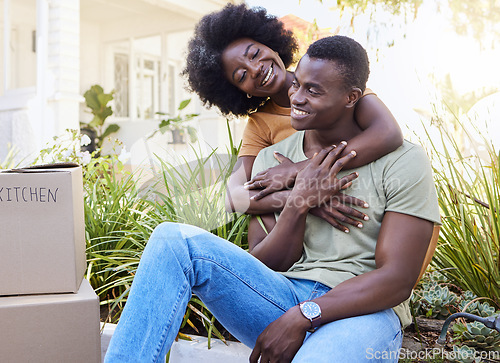 Image of Every embrace is precious. a young couple moving into their new house.