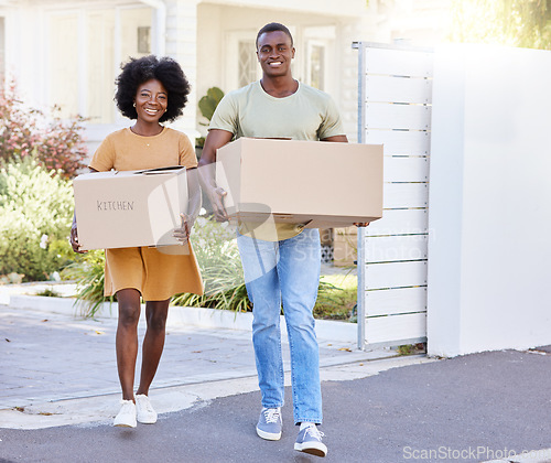 Image of Its moving day. a young couple moving into their new house.