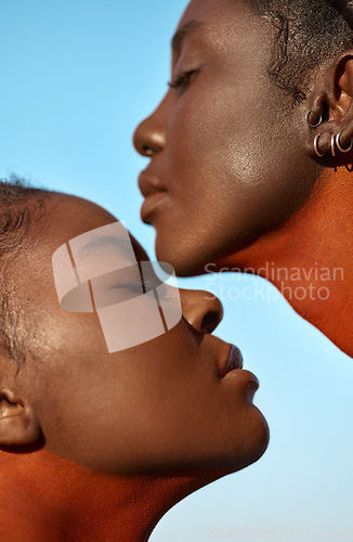 Image of Spiritual strength from another. two beautiful tribal women posing outside together.