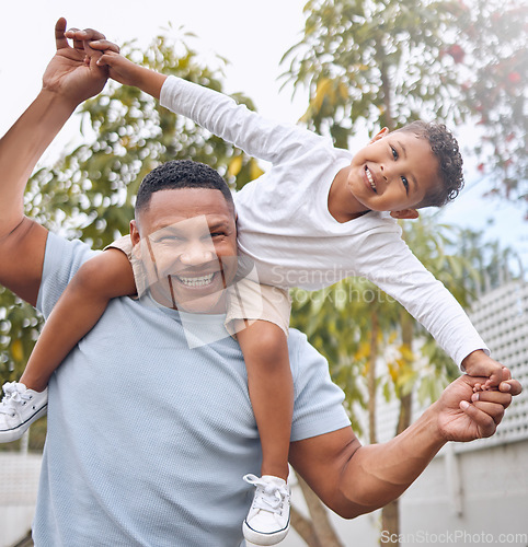 Image of My family, my pride. a father and son having fun in their backyard at home.