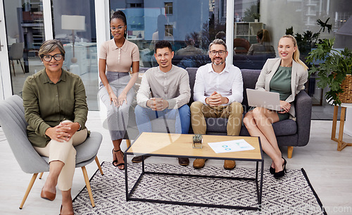 Image of Full body portrait of diverse group of businesspeople sitting in the office at night and brainstorming. Team of professional workers working a deadline and using a laptop and paperwork in a meeting