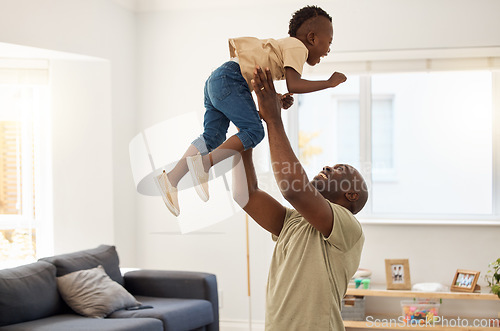 Image of Playtime with dad. a father and son spending time together at home.