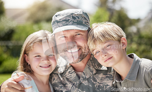 Image of In family life, love is the oil that eases friction. a father returning from the army hugging his children outside.