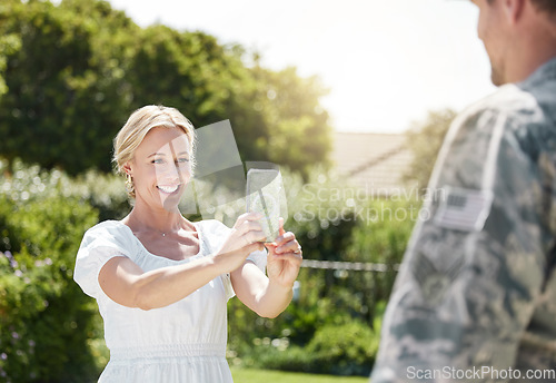 Image of A supportive family is what builds a home. a wife taking a picture of her husband outside.