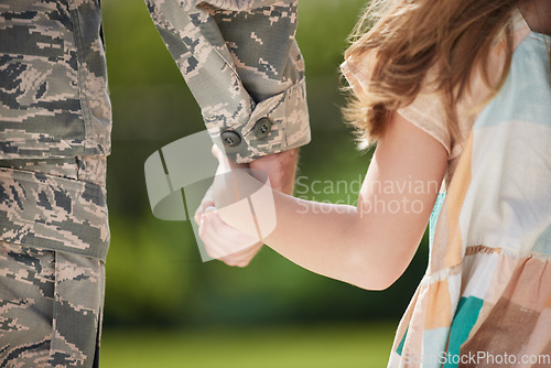 Image of Our most basic instinct is for love. a unrecognizable man holding his daughters hand outside.