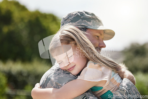 Image of Family, like the strength of an army. a father returning from the army hugging his daughter outside.