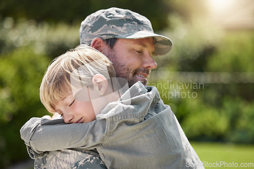 Image of Family means no one gets left behind. a father returning from the army hugging his son outside.