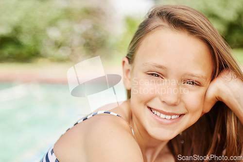 Image of Being in the pool cools me off. an adorable little girl outside on a sunny day.