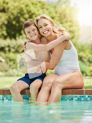 Image of Some time by the pool is just what we needed. a woman and her young son bonding by the poolside.