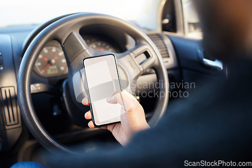 Image of The only impossible journey is the one you never begin. a young man sitting in a car while using his phone.