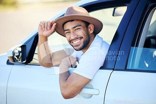 Image of If you’re on a road trip, you need driving music. a young man enjoying an adventurous ride in a car.