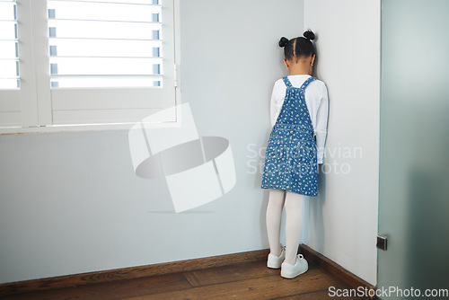 Image of Hurt little tender heart. an unrecognizable little girl facing the wall and as punishment in a room at home.