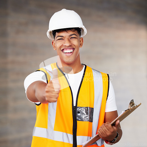 Image of These hands are magic. a young contractor showing the thumbs up at work.