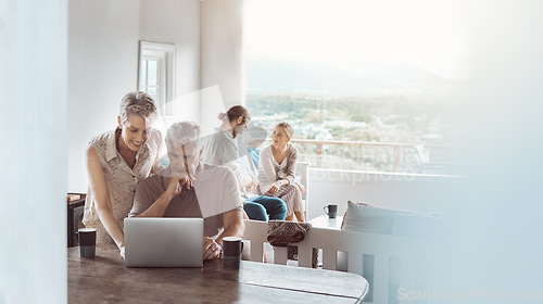 Image of Come join us for coffee when youre done. a mature couple using a laptop at home while a young couple sits in the background.