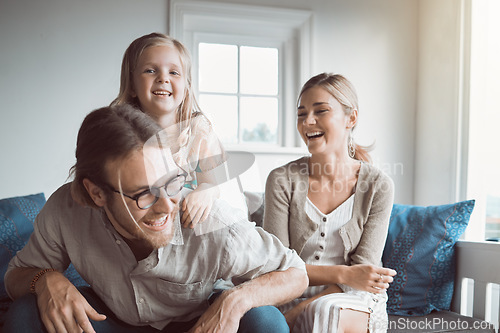 Image of A happy family is one of lifes greatest joys. a young couple and their daughter sitting together at home.