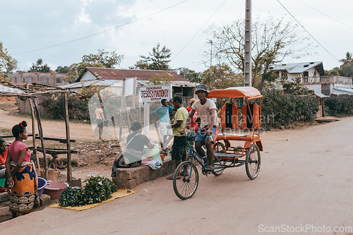 Image of Traditional rickshaw on the city streets. Rickshaws are a common mode of transport in Madagascar.