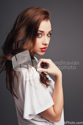 Image of Beauty is in the eye of the beholder. a beautiful young woman posing against a studio background.