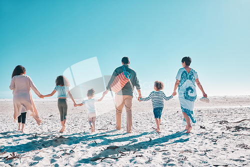 Image of Come take a walk on the beach with us. a multi-generational family spending the day at the beach.