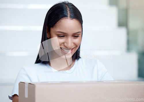 Image of A special delivery just for me. a young woman receiving her delivery from the courier.