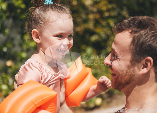 Image of Daddy ca teach you how to swim. an adorable little learning to swim with her father.