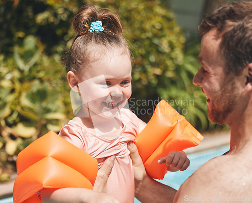 Image of Can I let go. an adorable little learning to swim with her father.