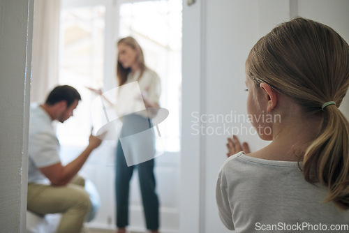 Image of I think were done. a little girl watching her parents argue at home.