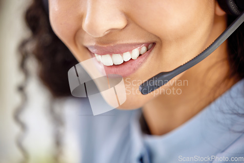 Image of Generating sales leads that develop into new customers. Closeup shot of an unrecognisable businesswoman wearing a headset while working in a call centre.