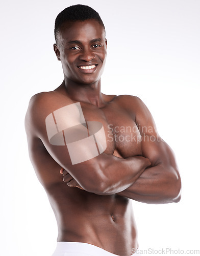 Image of Living boldly. Portrait of a handsome young man posing shirtless against a white background.