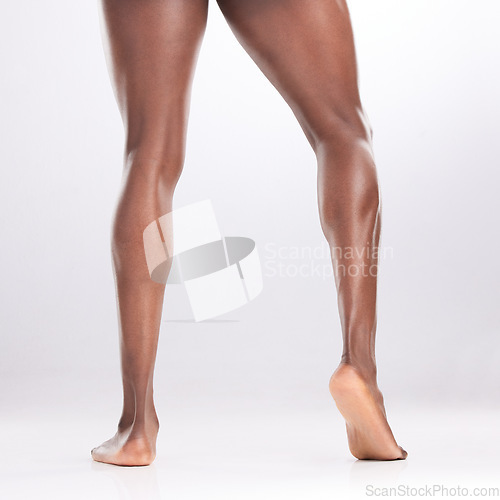 Image of He NEVER skips leg day. an unrecognizable man showing off his muscular legs while posing against a white background.