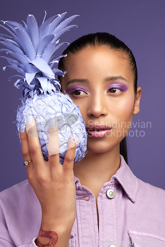 Image of Soft on the inside and purple on the outside. Studio shot of a beautiful young woman modelling a purple colour concept.