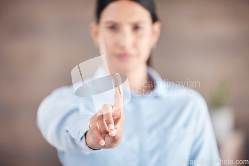 Image of Closeup of of the hand in the foreground of a mixed race businesswoman gesturing stop or wait while standing in her office. Stop gender based violence and sexual harassment in the workplace. Take a s