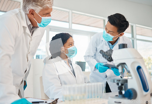 Image of A few brilliant minds working on a breakthrough. a group of scientists working together in a lab.