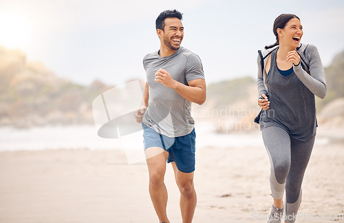 Image of Running promotes the release of powerful hormones that will boost your mood. a sporty young couple running together on the beach.