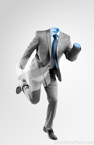 Image of You can never outrun your real self. Studio shot of an invisible businessman running against a grey background.