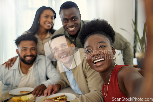 Image of A selfie with the people who always have my back. a woman taking a selfie with a group of friends at home.